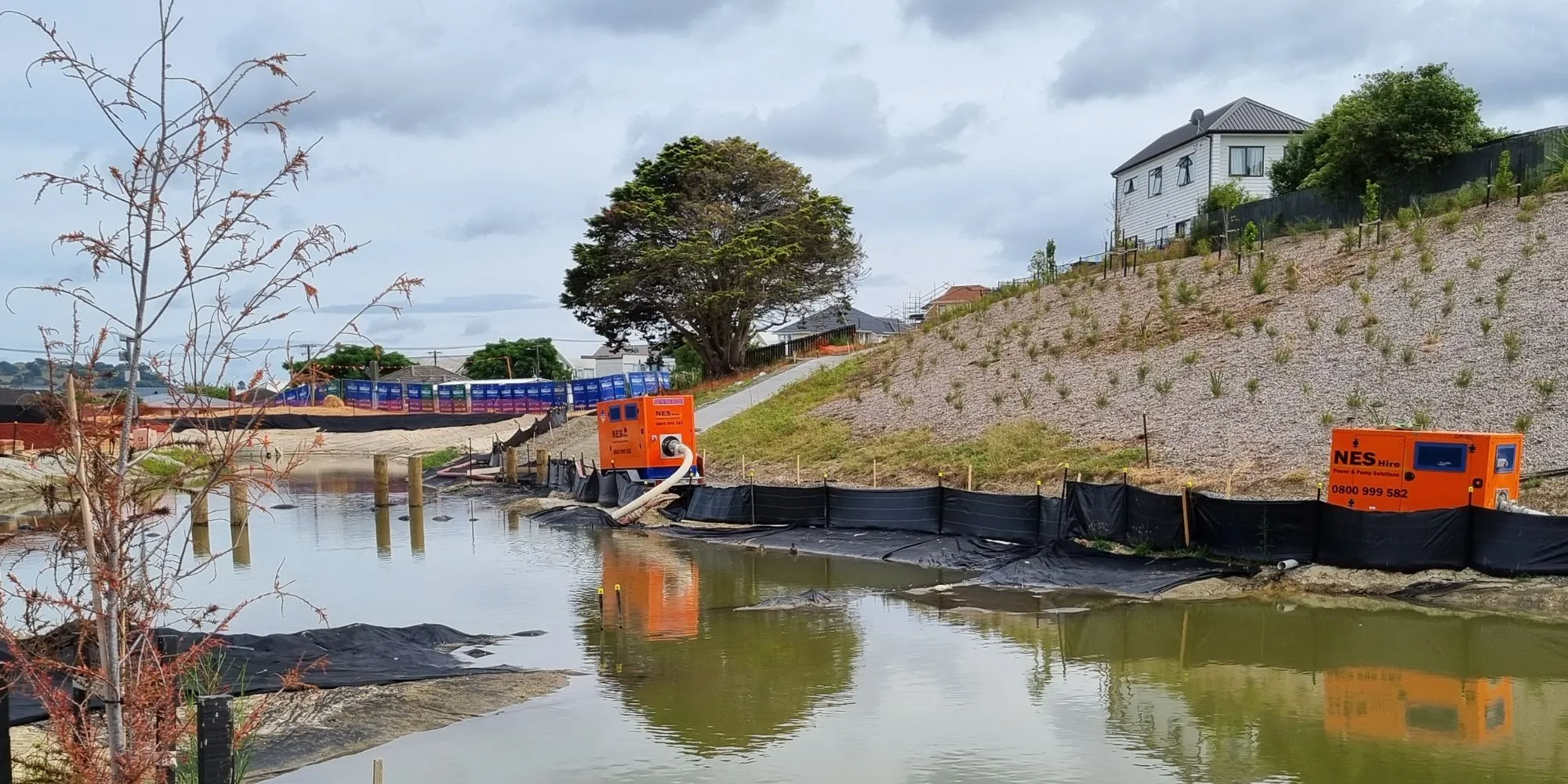 Dewatering and flood water management pumps hired from NES Hire in action removing flood waters.