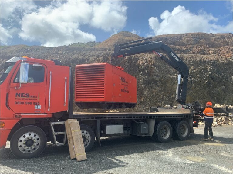 NES unloading a generator off a truck in a power emergency.