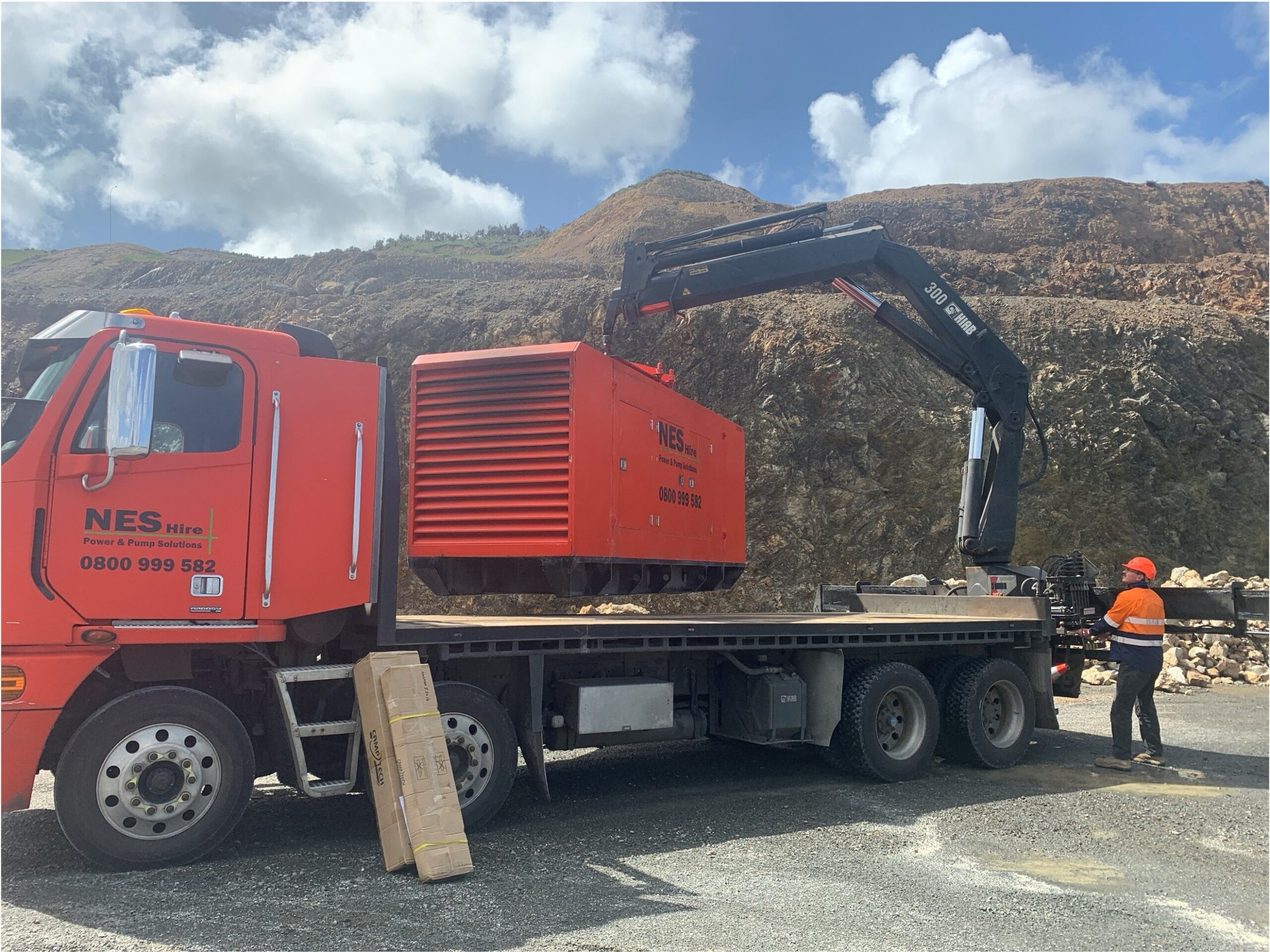 NES unloading a generator off a truck in a power emergency.